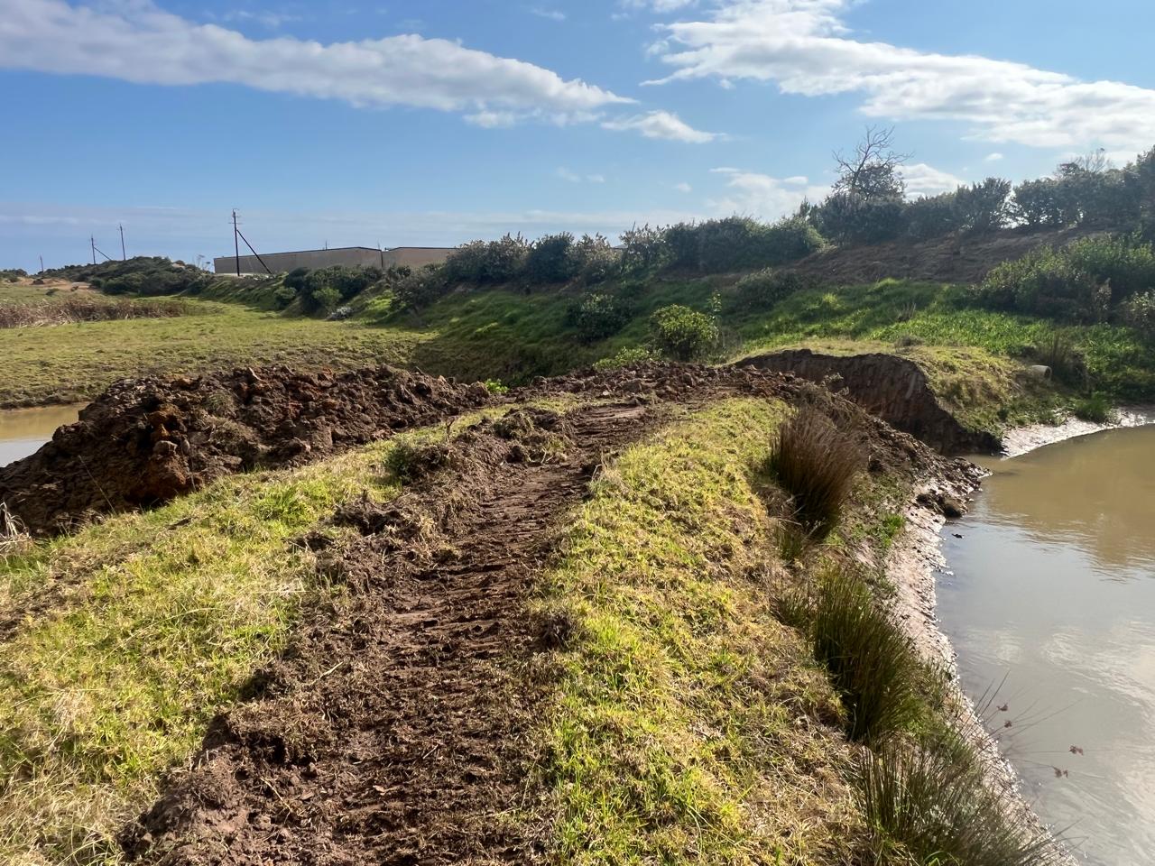 September 2025 earthworks at Erf 8010 — churned track running along a watercourse.
