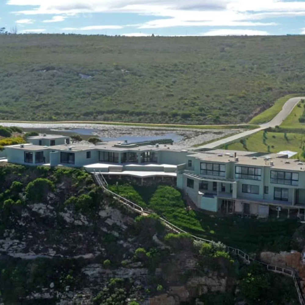 Existing clifftop guest house at Erf 8010 — exterior view from the cliff path.